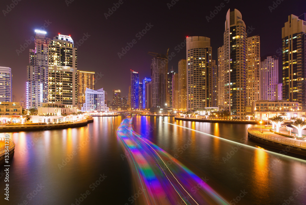 Busy promenade and the bay in Dubai Marina in the evening,Dubai,United Arab Emirates