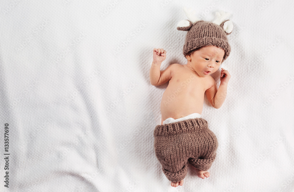 Newborn infant baby boy on a blanket