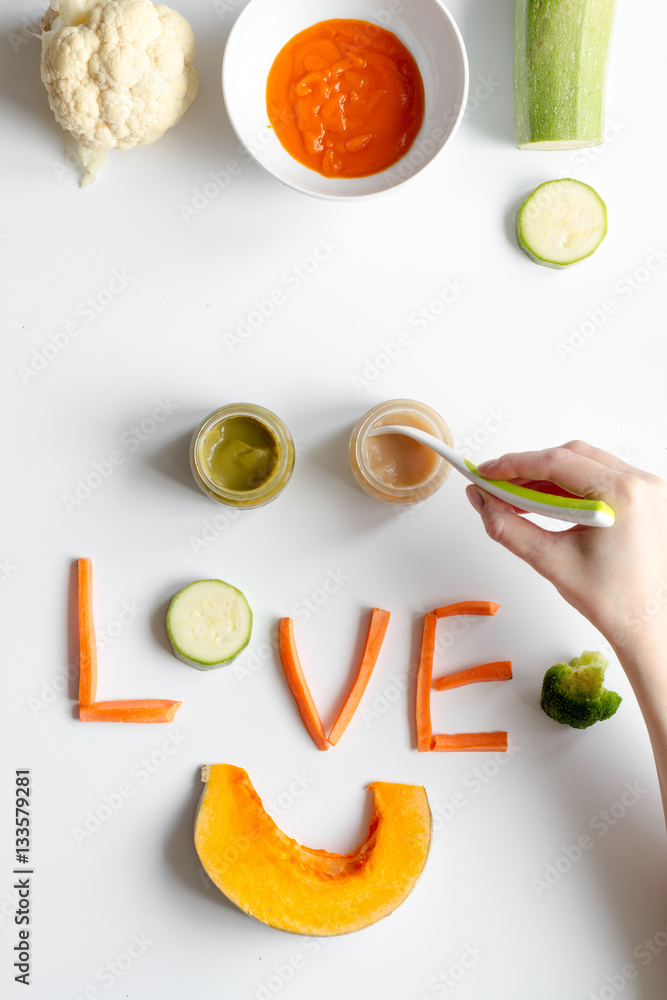 cooking vegetable puree for baby on white background top view