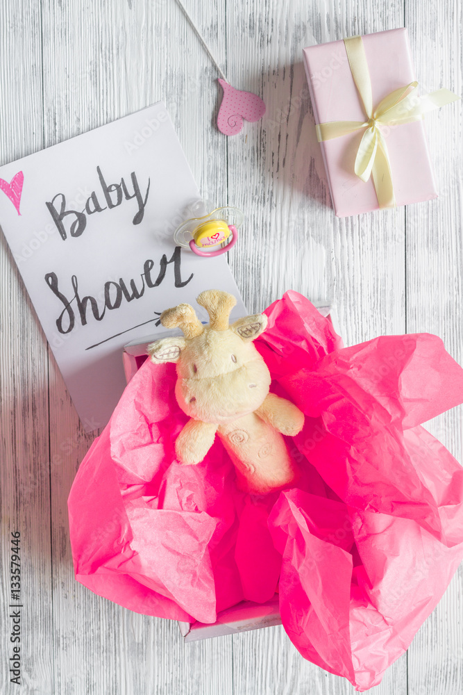 birth of girl - baby shower concept on wooden background