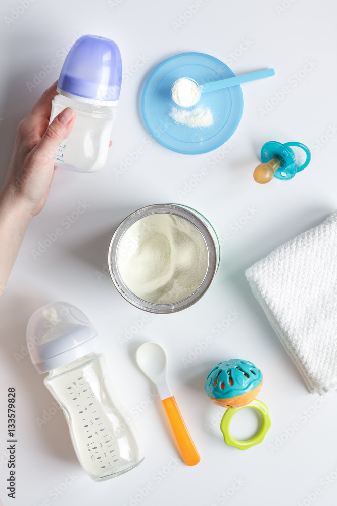 preparation of mixture baby feeding on white background top view