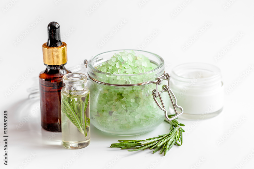 organic cosmetics with extracts of herbs rosemary on white background