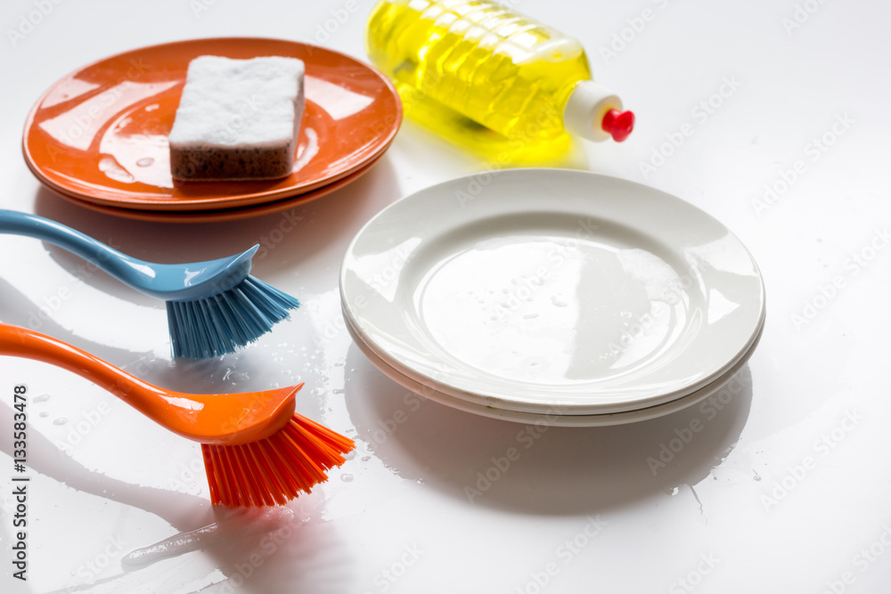 concept of washing dishes on white background