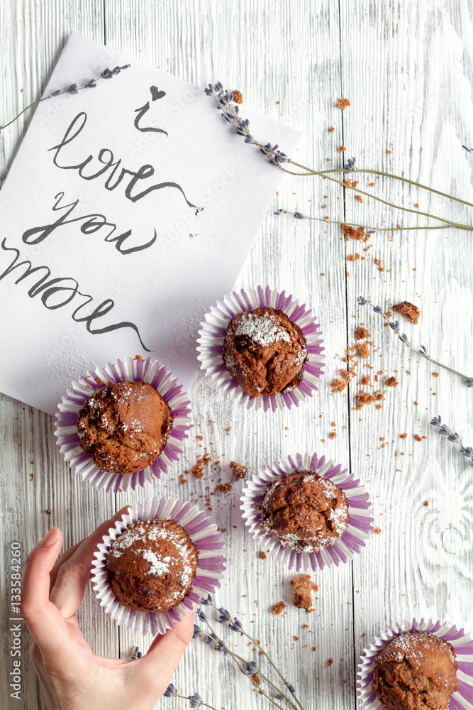 concept of Valentines Day cupcakes wooden background top view