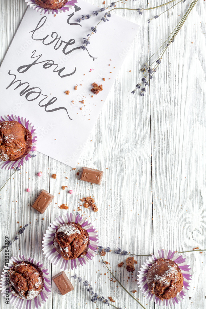 concept of Valentines Day cupcakes wooden background top view