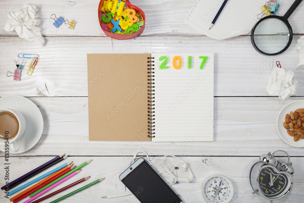 Top view of Blank paper and pencil ,smartphone,coffee,almond