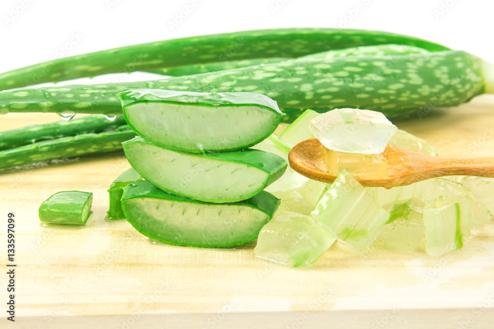 the sliced and leaf of fresh aloe vera on  wooden plate 