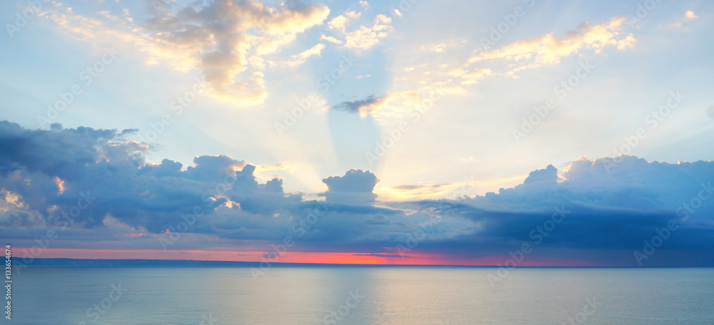 Panorama view of sunset sunrise sea ocean summer with textured clouds and beautiful sunlight in blue