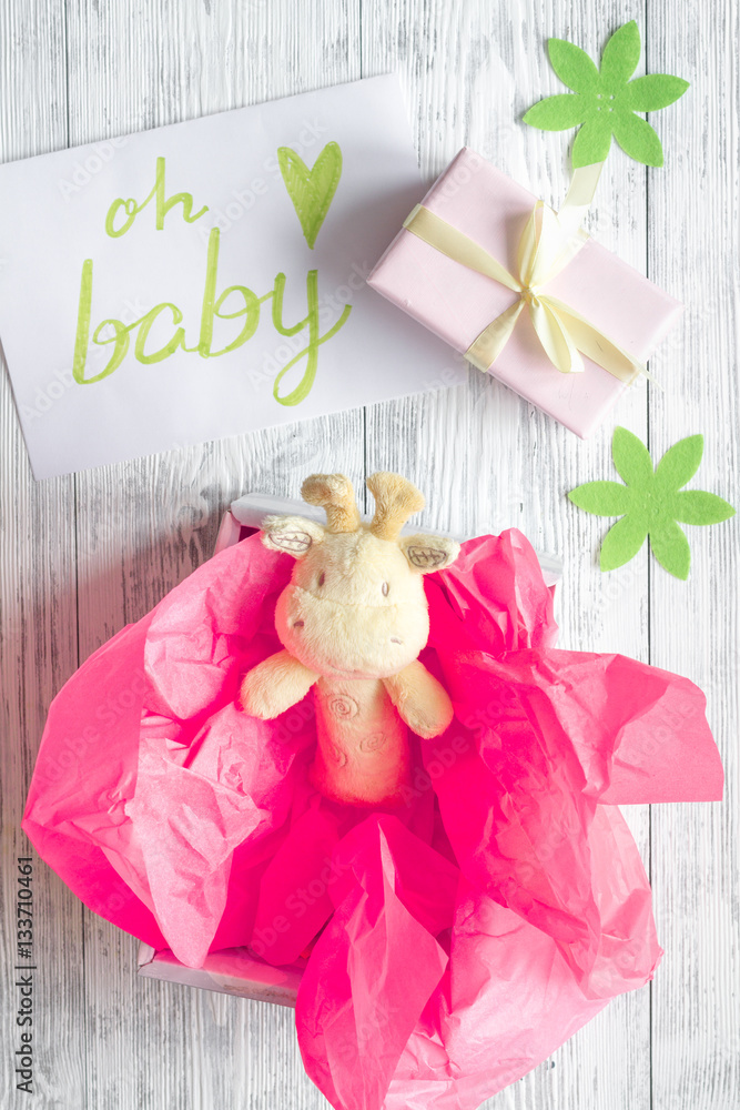 birth of girl - baby shower concept on wooden background