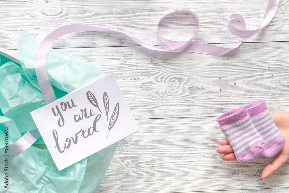 birth of child - baby shower concept on wooden background