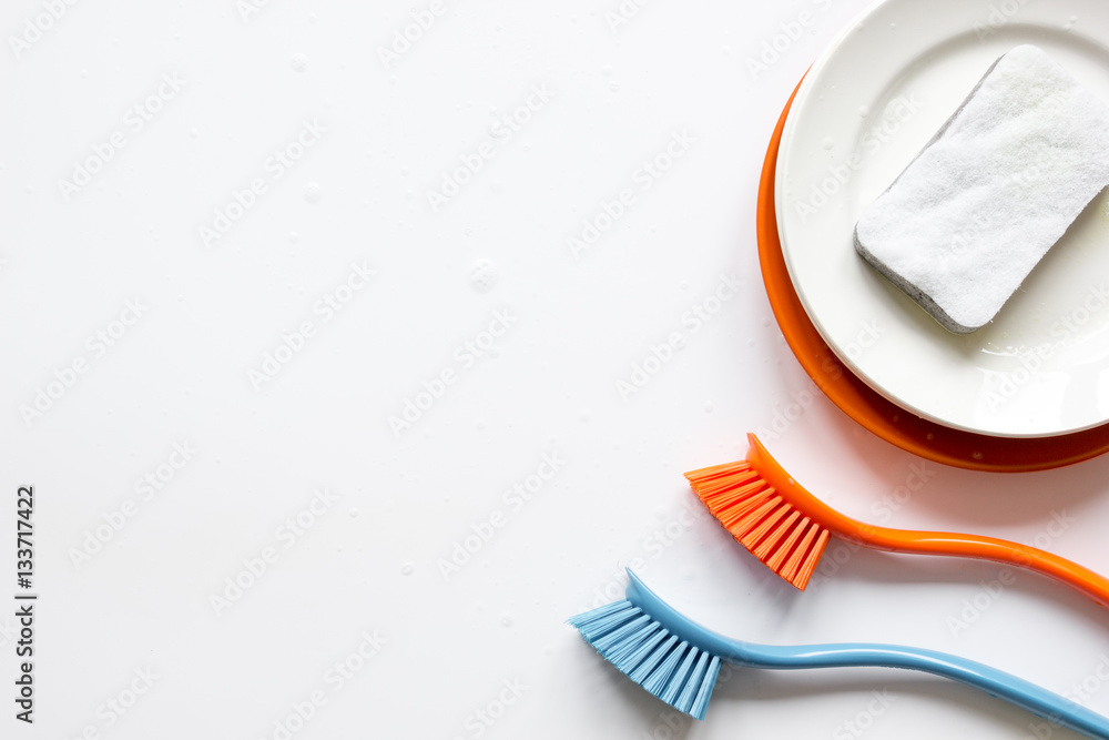 concept of washing dishes on white background top view