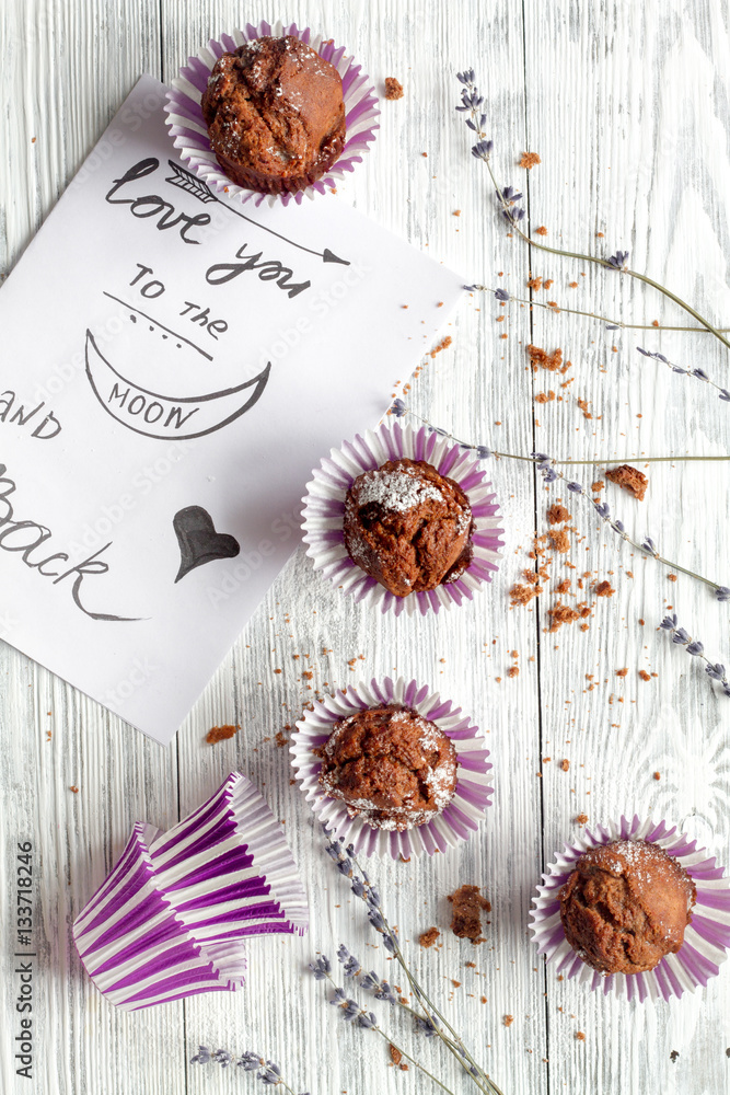 concept of Valentines Day cupcakes wooden background top view