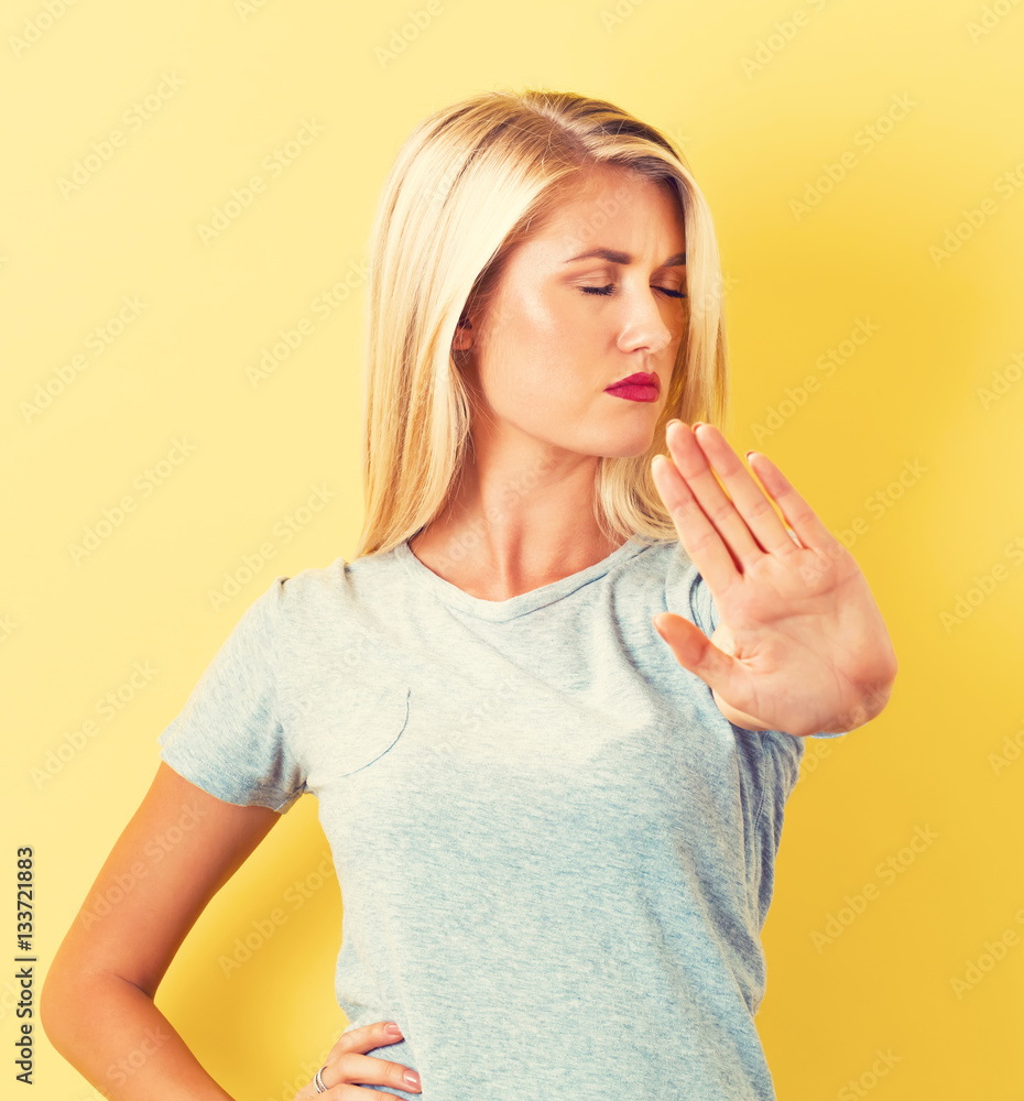 Young woman making a rejection pose