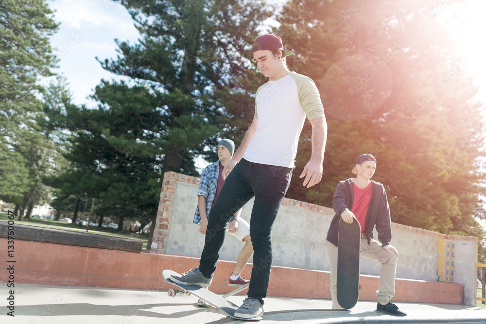 Guys skateboarders in street