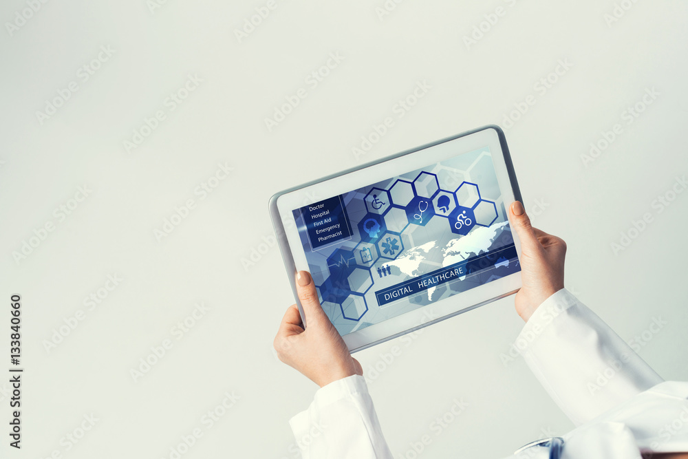 Close of female doctor hands working with tablet pc computer