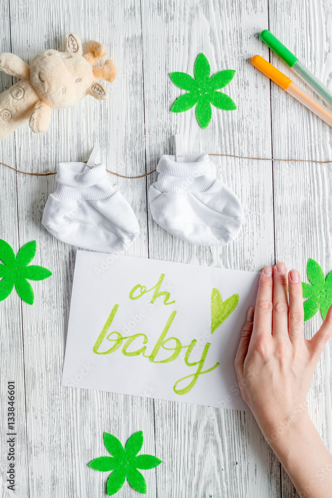 birth of child - baby shower concept on wooden background