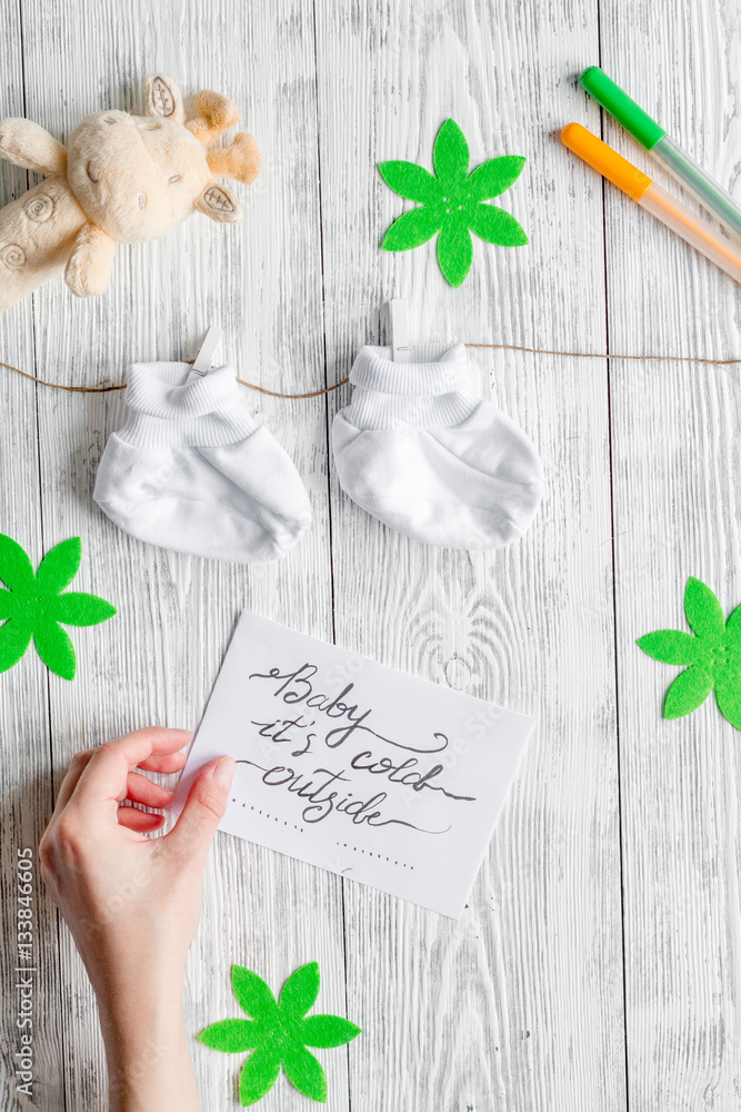 birth of child - baby shower concept on wooden background