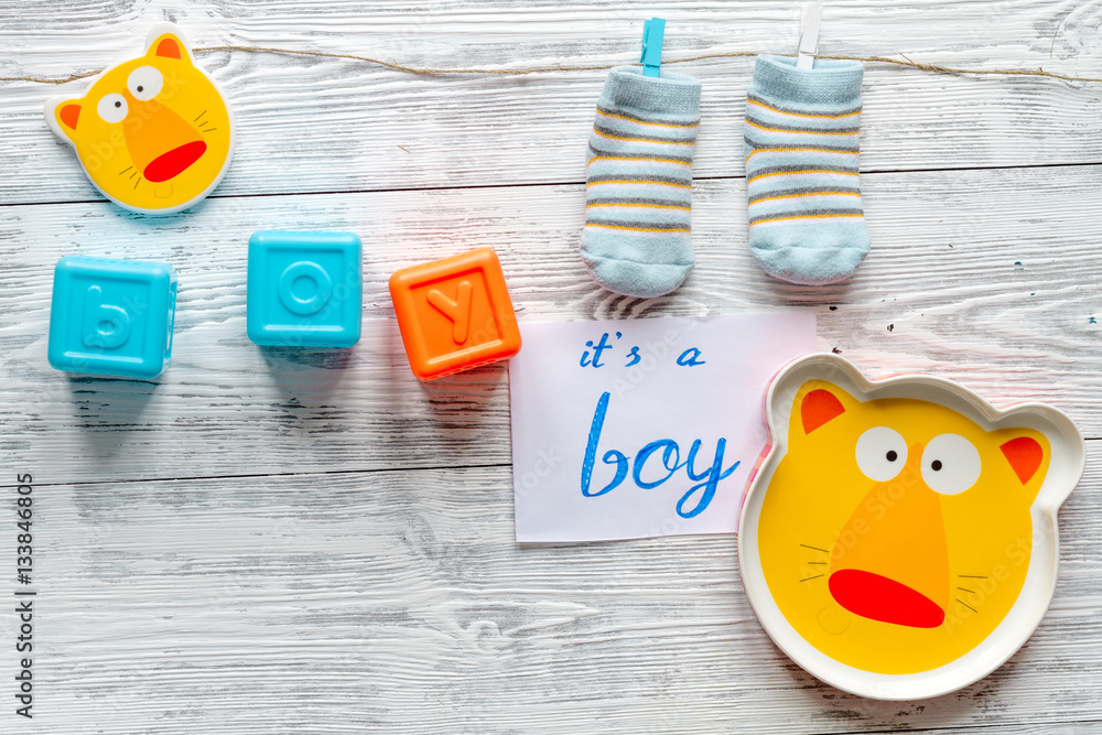 birth of boy - baby shower concept on wooden background