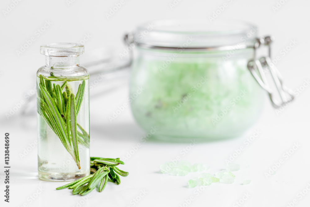 organic cosmetics with extracts of herbs rosemary on white background