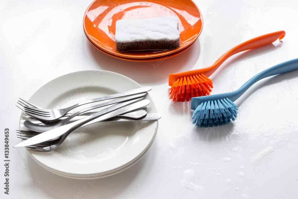 concept of washing dishes on white background