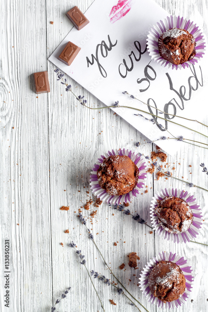 concept of Valentines Day cupcakes wooden background top view