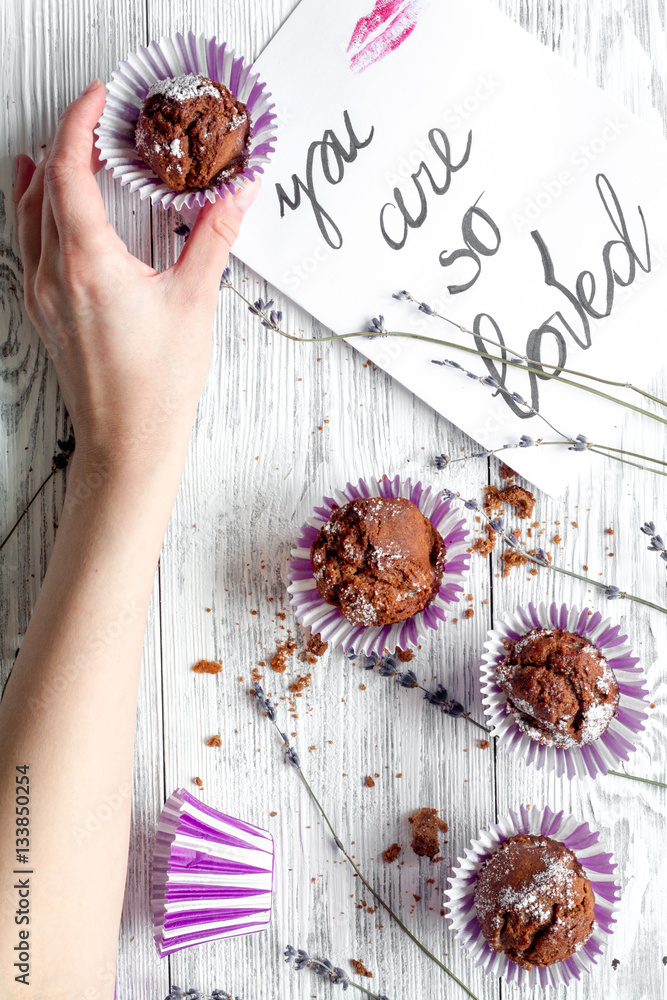 concept of Valentines Day cupcakes wooden background top view