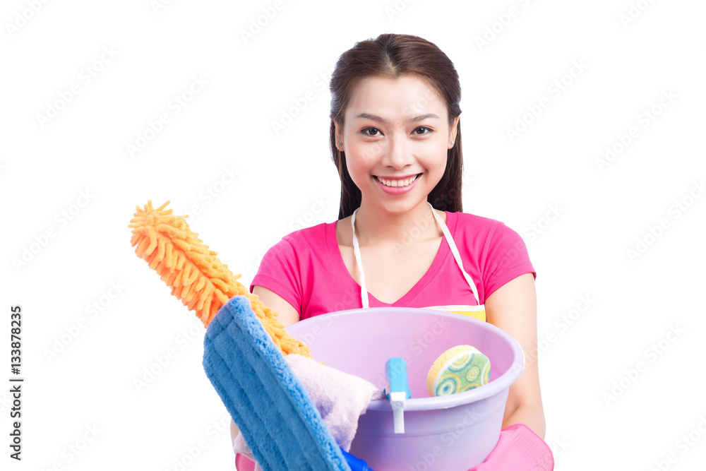 Young asian woman holding floor brush, bucket and rag, isolated