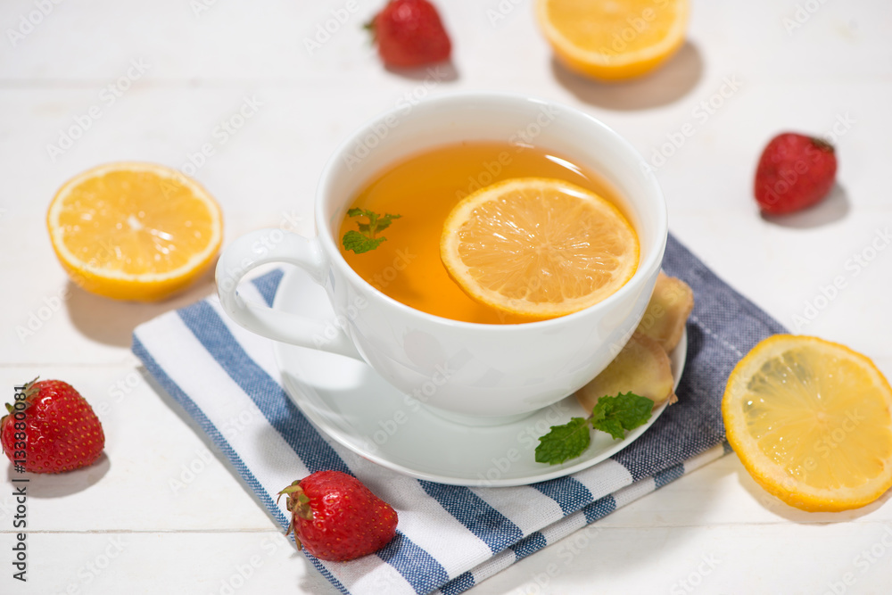 Healthy ginger tea ingredients on a wooden table