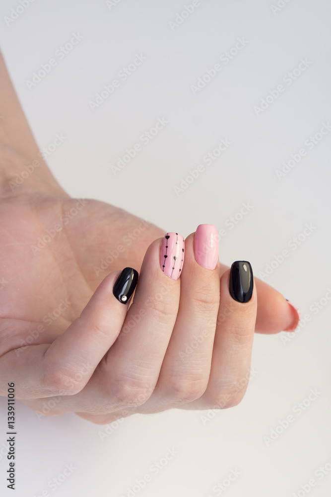 Amazing manicure and natural nails with gel polish. Attractive modern nail art design.