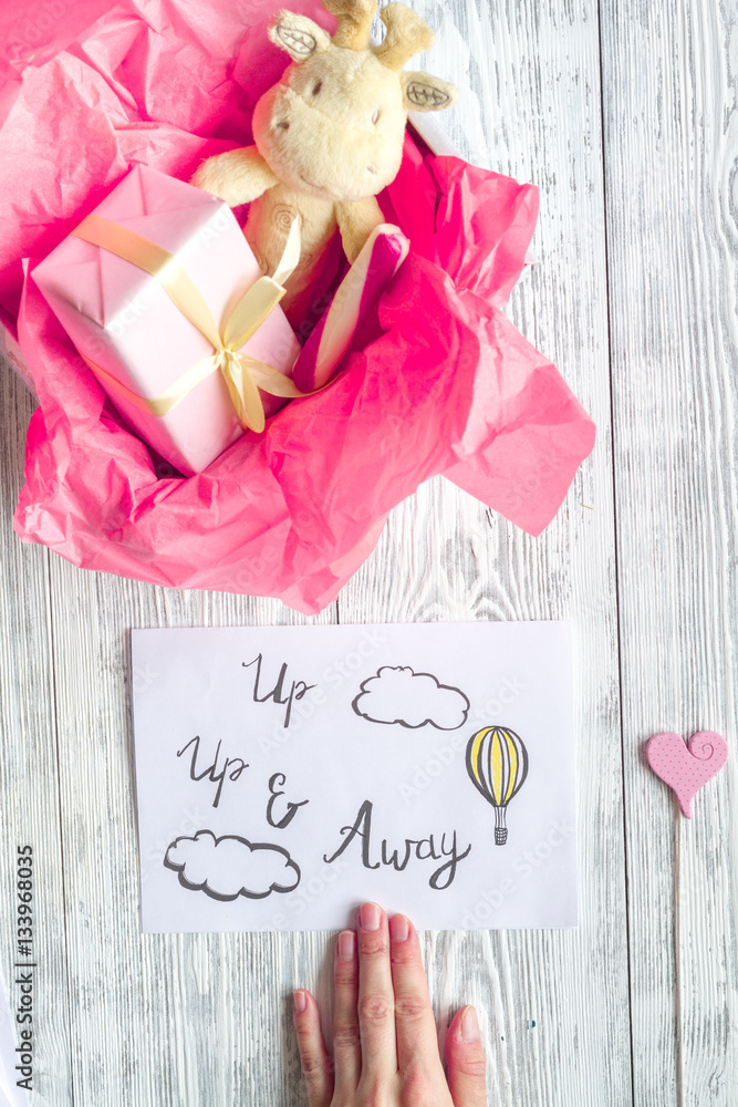 birth of girl - baby shower concept on wooden background