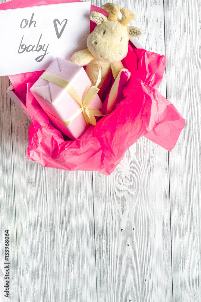 birth of girl - baby shower concept on wooden background