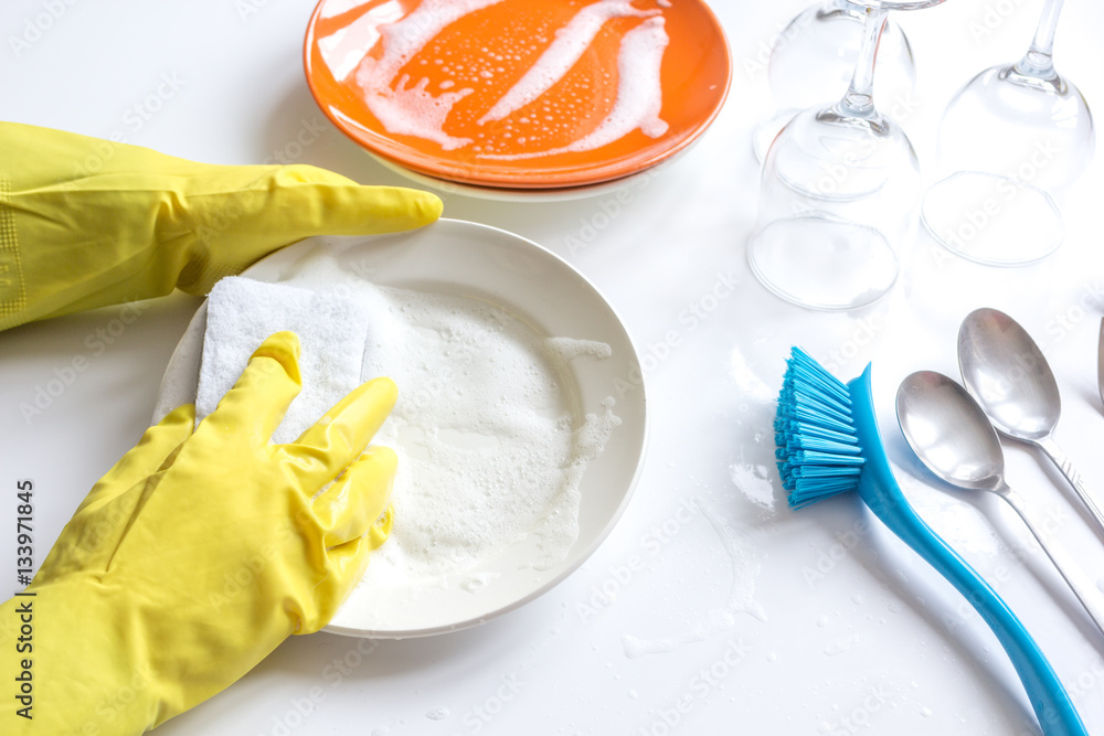 concept of woman washing dishes on white background