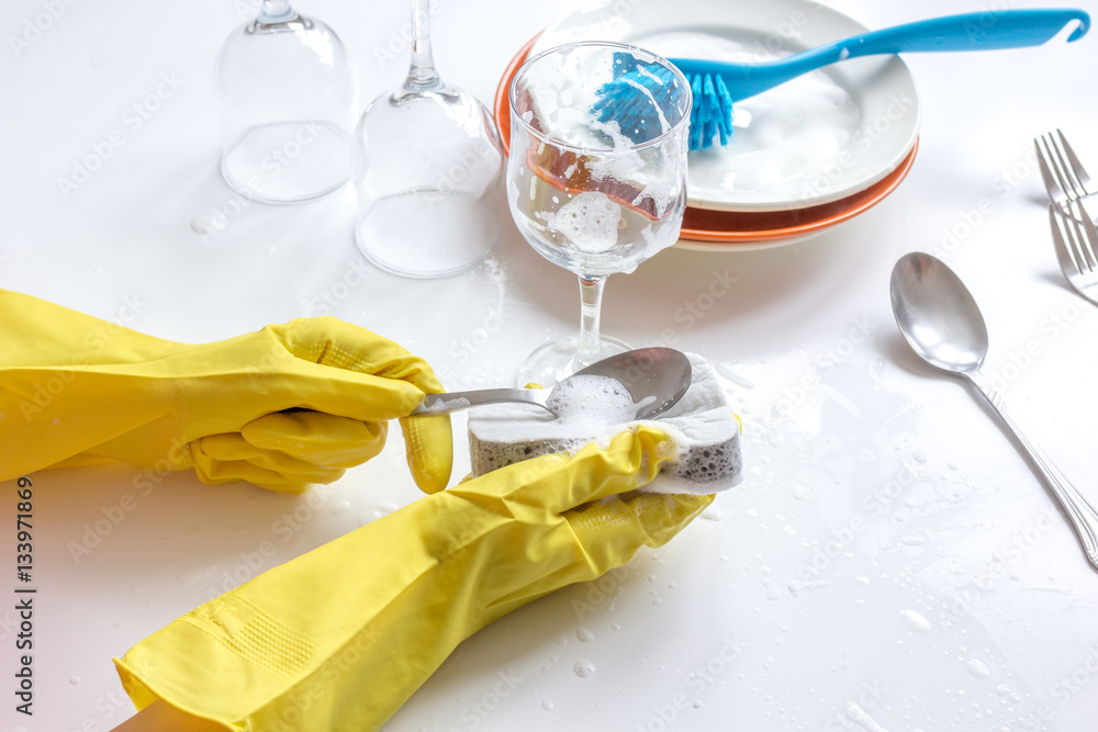 concept of woman washing dishes on white background