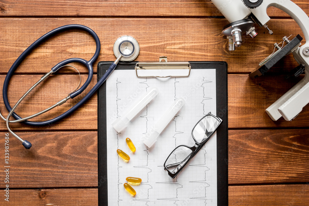 doctor workplace at wooden table in lab top view