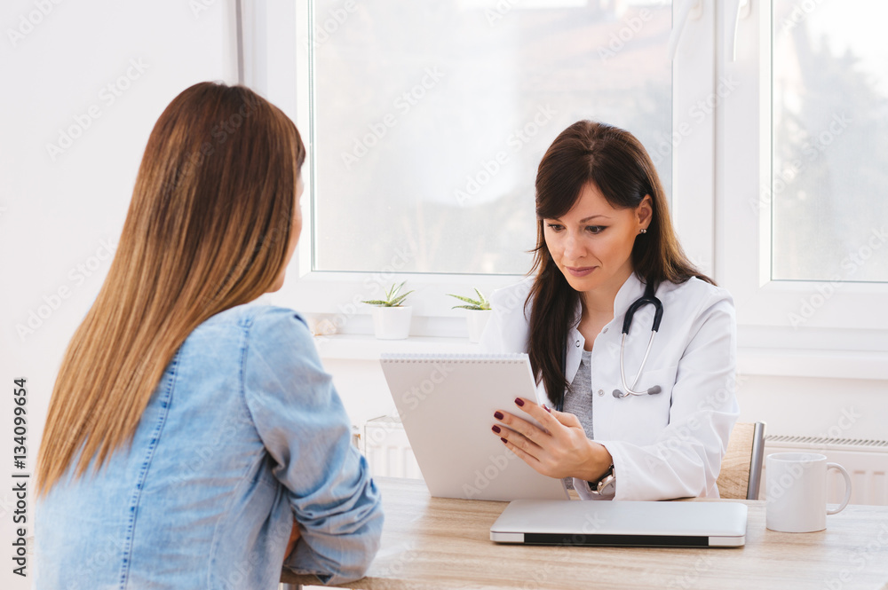 Hospital: Cheerful Doctor Gives Reading Results To Patient