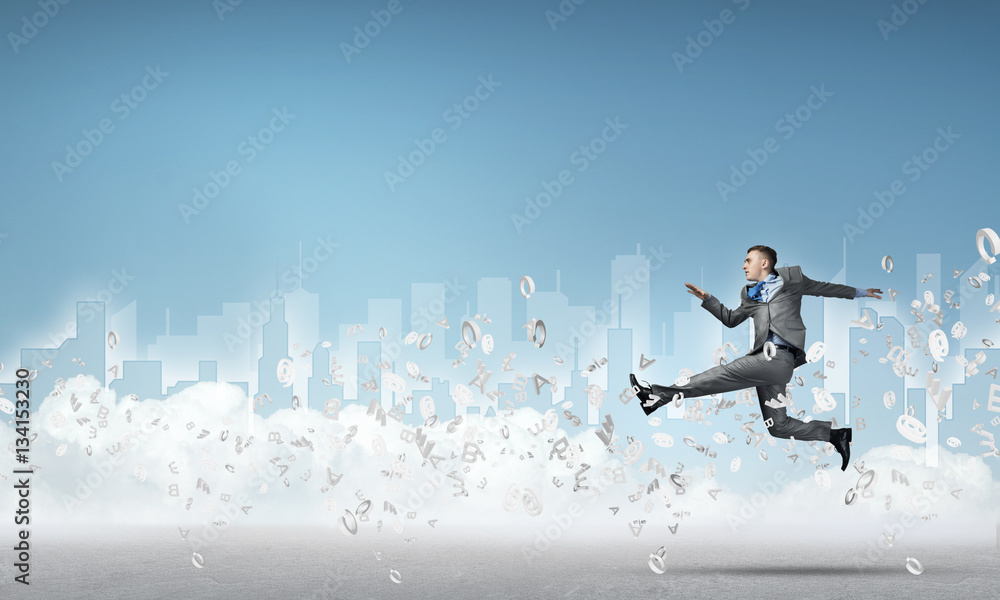 Businessman jumping high