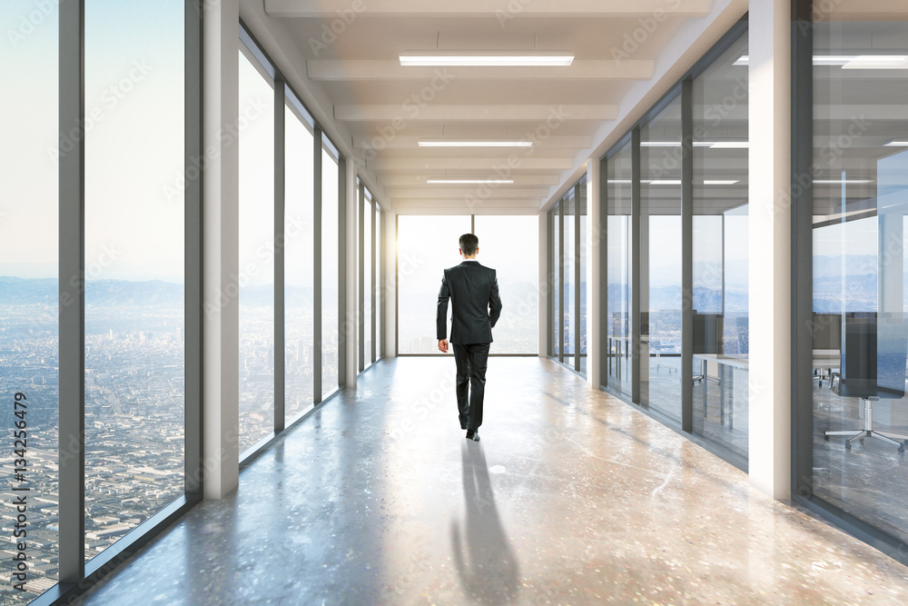 Businessman walking on corridor