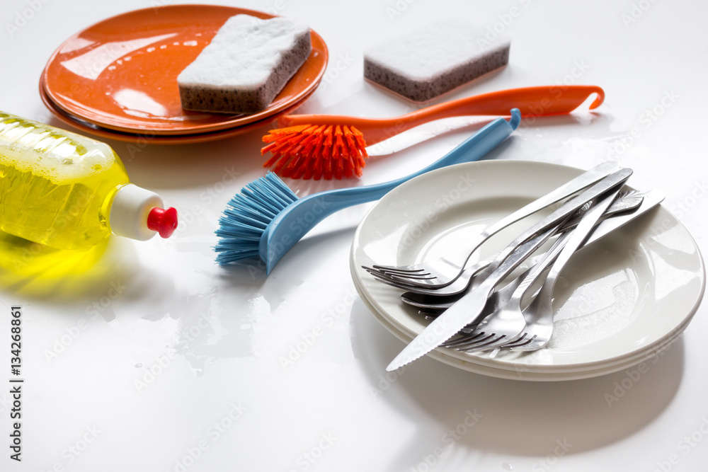 concept of washing dishes on white background