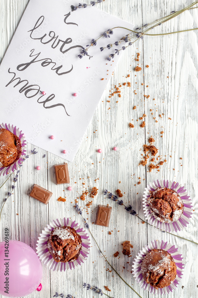 concept of Valentines Day cupcakes wooden background top view