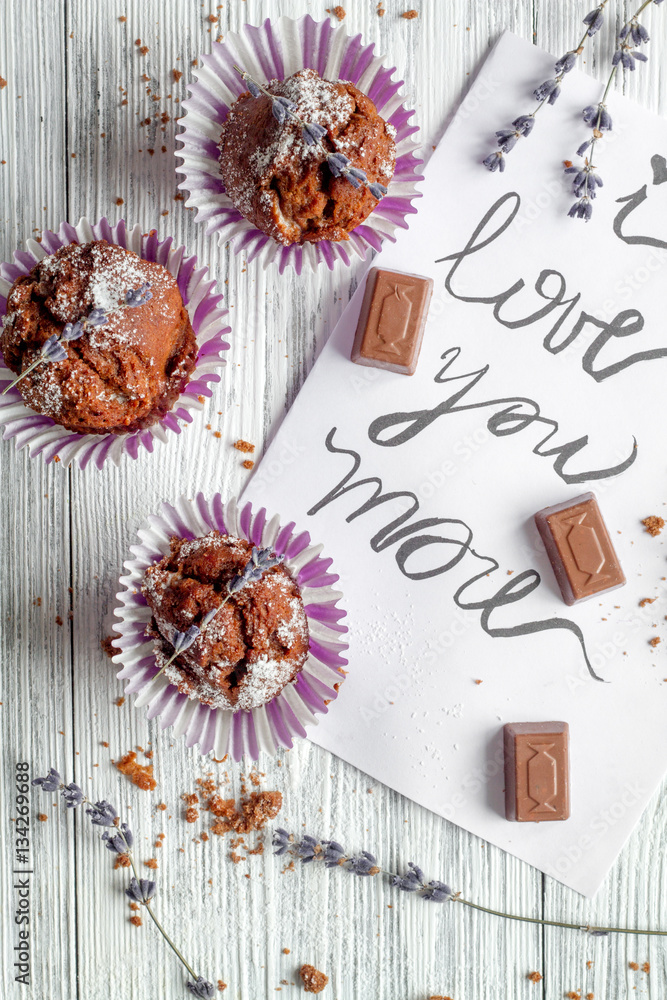 concept of Valentines Day cupcakes wooden background top view