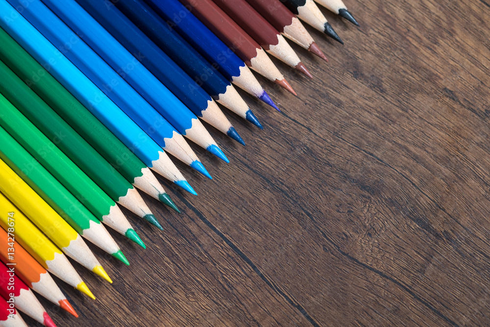 Color pencils on wood background