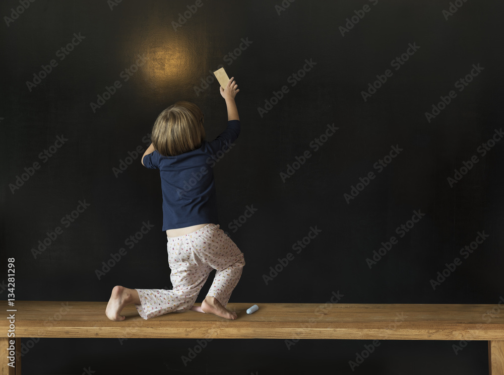 Little Girl Writing Blackboard Concept