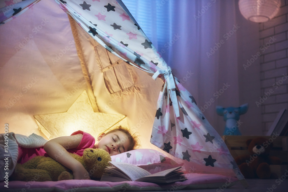 girl is napping in the tent