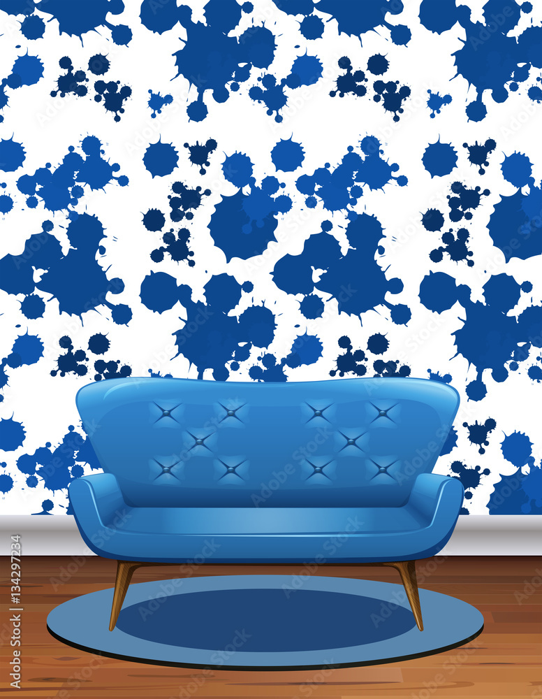 Blue sofa in room with blue splash wallpaper