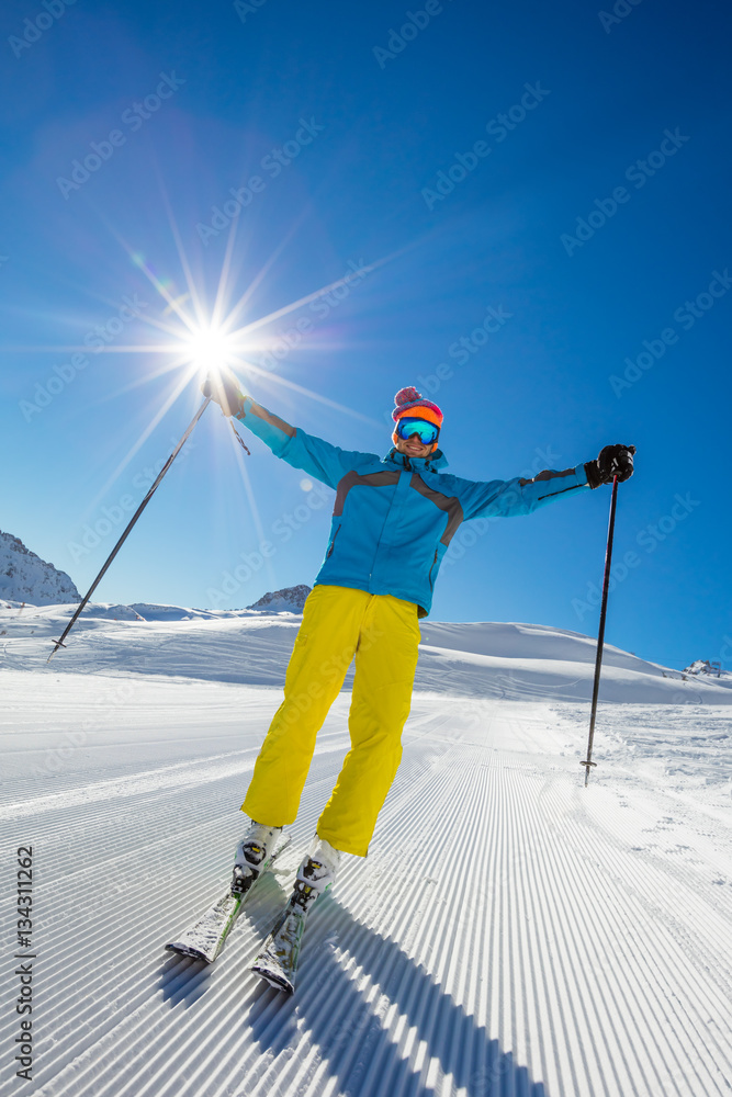 Skier on piste in sunny day. Skiing concept.