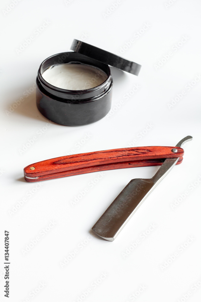 white desktop with tools for shaving beards