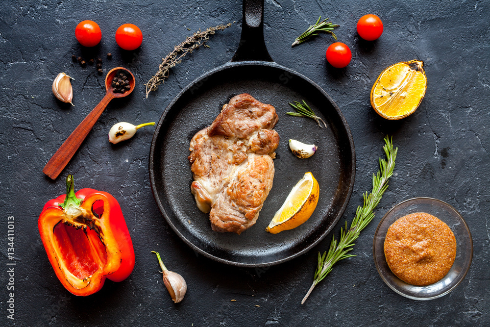 concept cooked steak on dark background top view