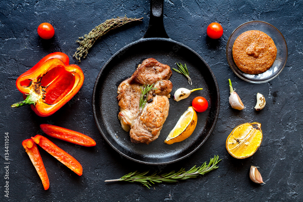 concept cooked steak on dark background top view