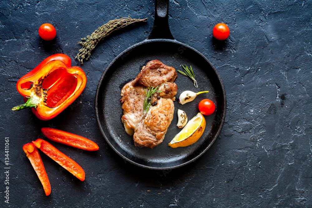 concept cooked steak on dark background top view