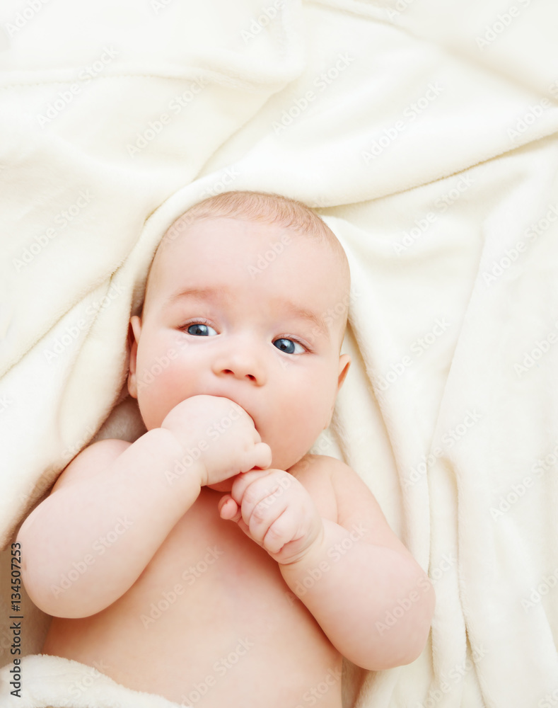 Baby sleeping covered with soft blanket